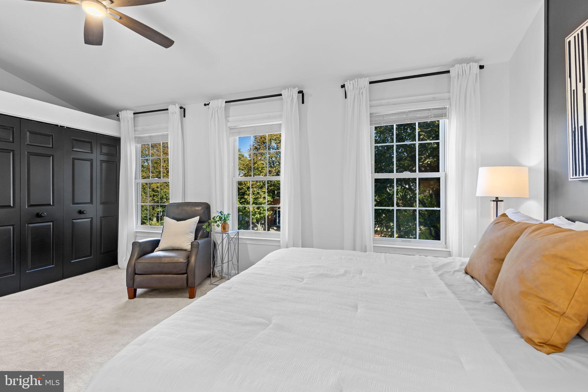 6223 Walkers Croft Way Alexandria, VA 22315 - Photo 21 of 38 a bedroom with a bed and glass window