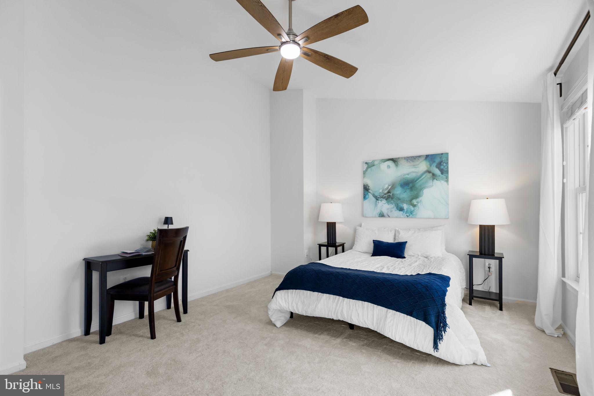 6223 Walkers Croft Way Alexandria, VA 22315 - Photo 26 of 38 a bedroom with a bed and a lamp on table