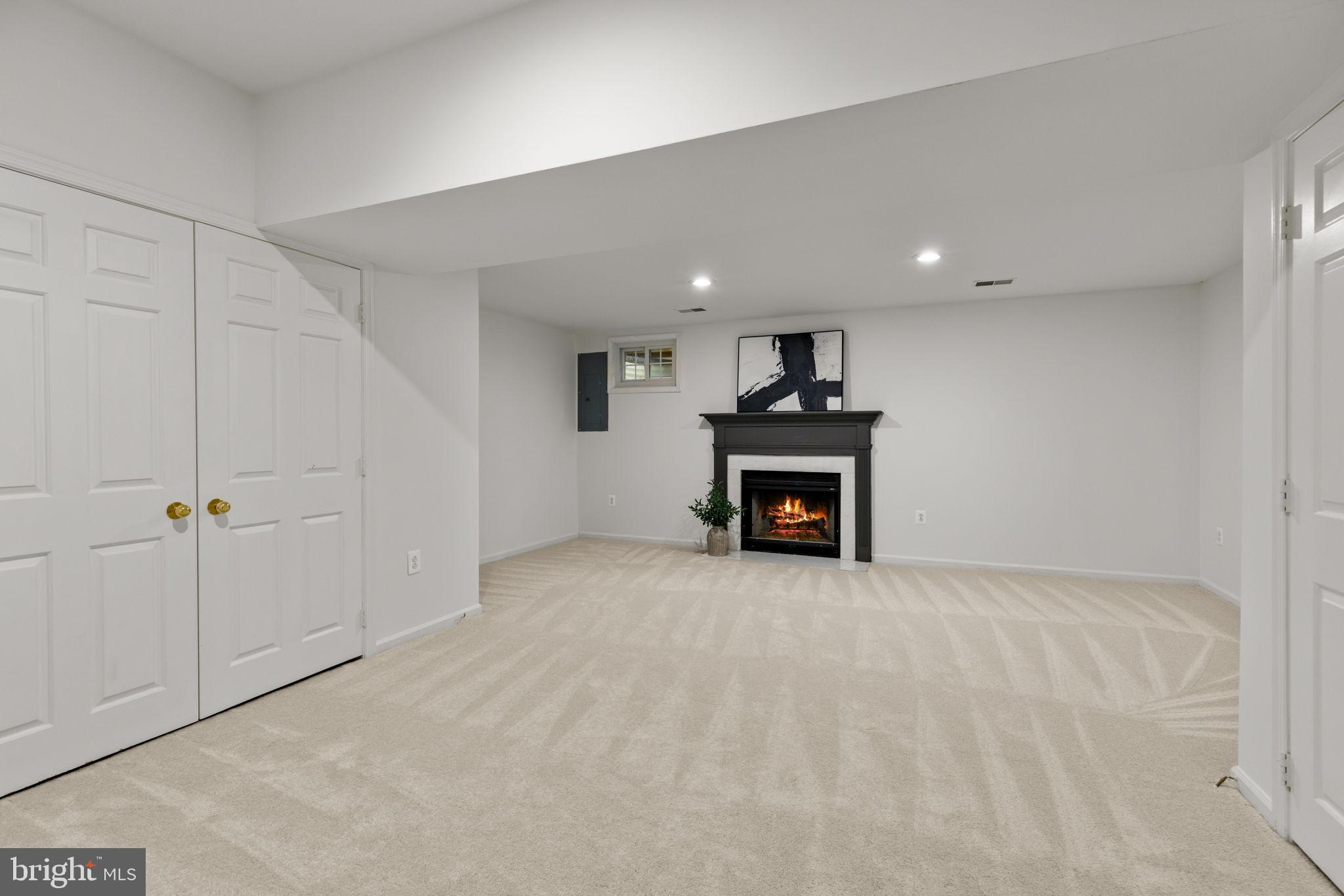6223 Walkers Croft Way Alexandria, VA 22315 - Photo 31 of 38 a view of an empty room with a fireplace