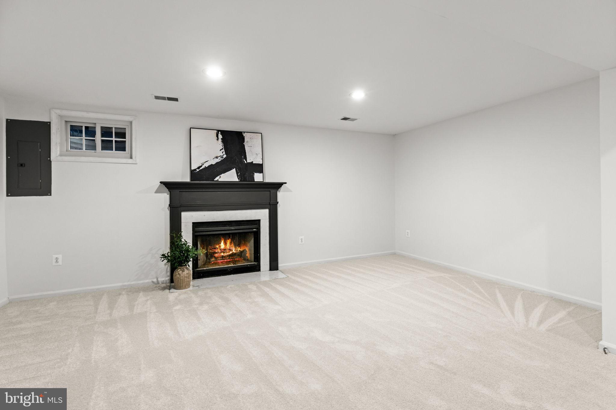 6223 Walkers Croft Way Alexandria, VA 22315 - Photo 32 of 38 a view of an empty room with a fireplace