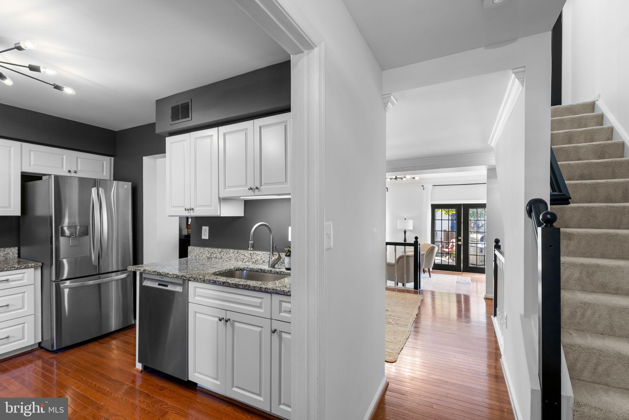6223 Walkers Croft Way Alexandria, VA 22315 - Photo 5 of 38 a kitchen with stainless steel appliances granite countertop a refrigerator and a sink