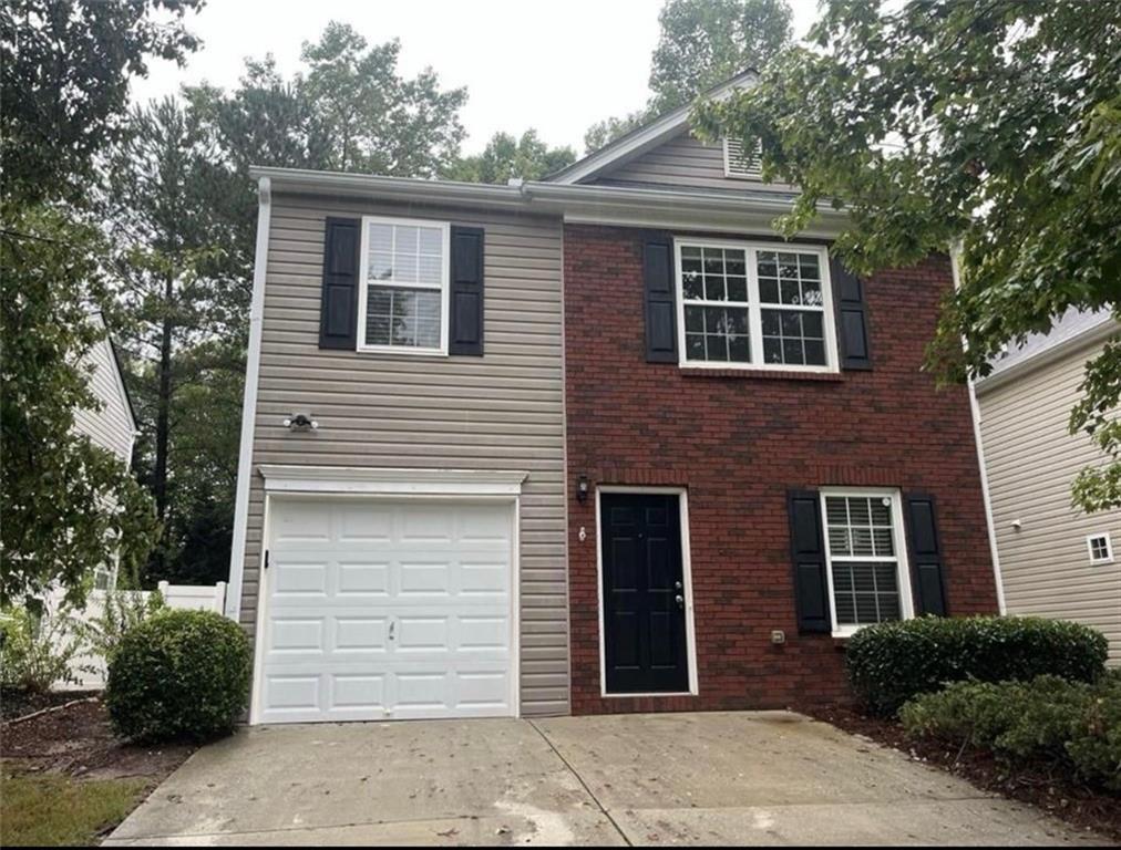 a front view of a house with a garage