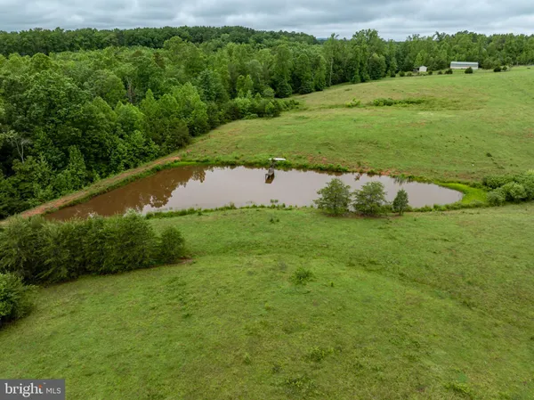 a view of a field with sitting area