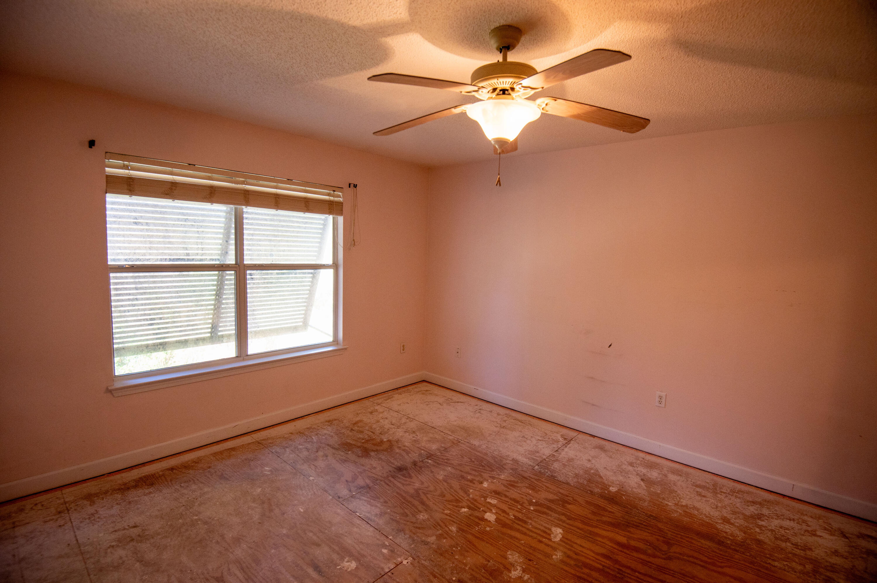 407 Calle Escada Santa Rosa Beach, FL 32459 - Photo 16 of 17 an empty room with a window and a fan