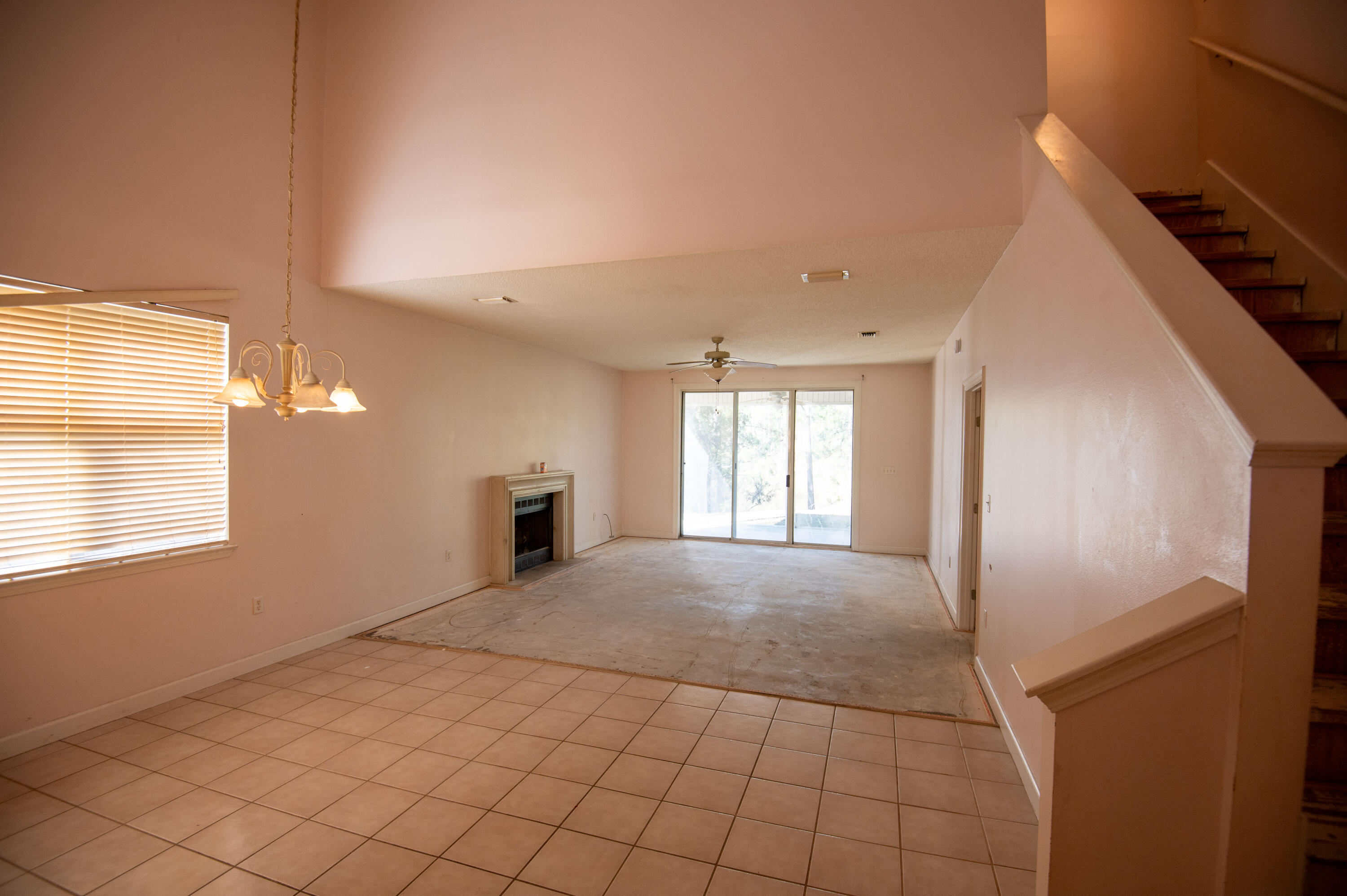 407 Calle Escada Santa Rosa Beach, FL 32459 - Photo 5 of 17 a view of an empty room with window and wooden floor