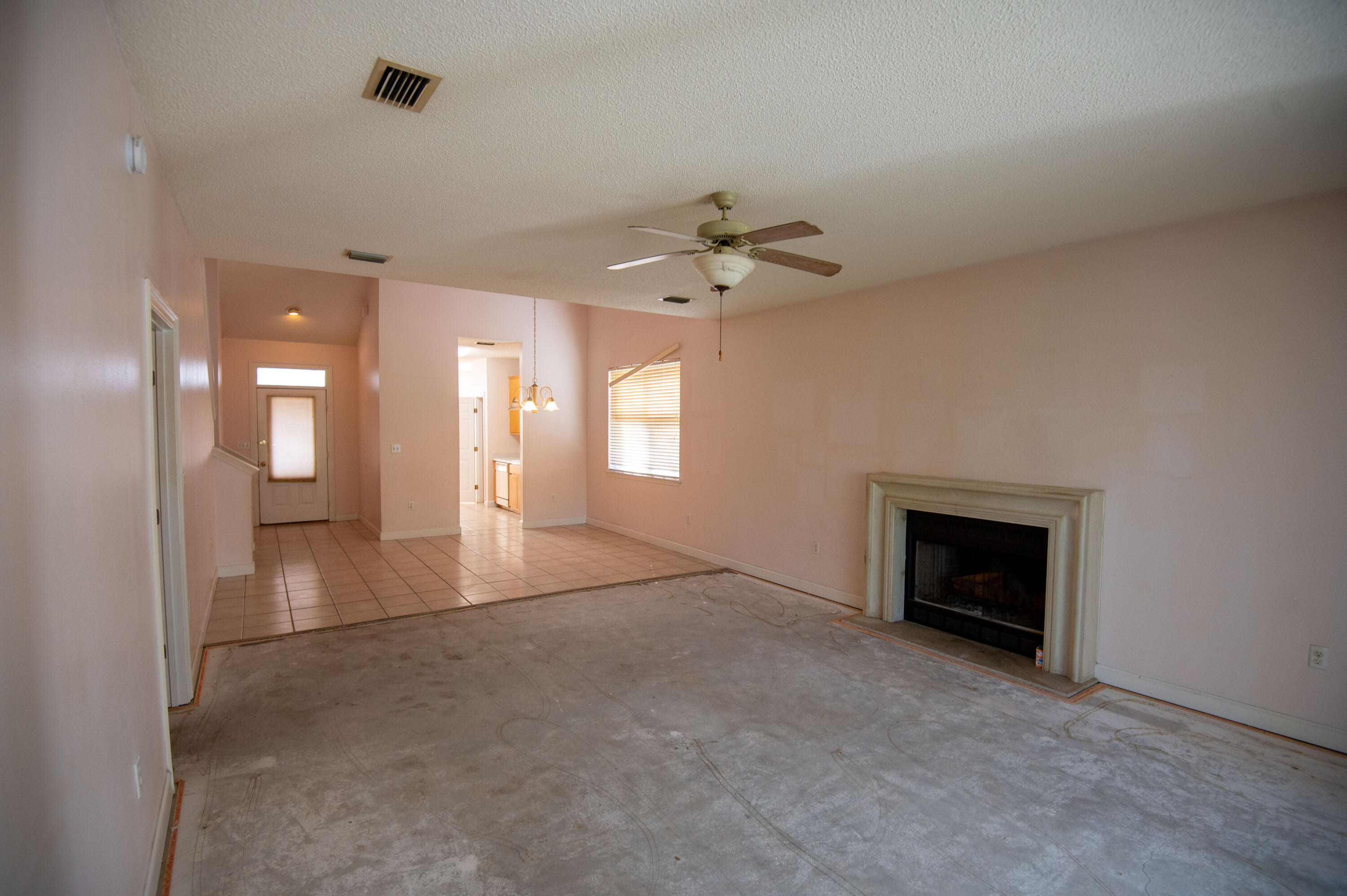 407 Calle Escada Santa Rosa Beach, FL 32459 - Photo 8 of 17 a view of an empty room with a fireplace