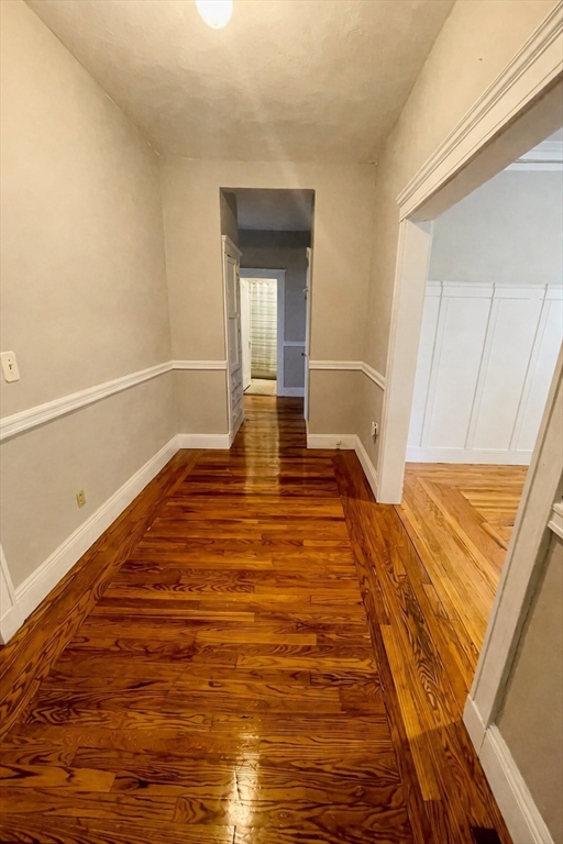 5 Feneno Terrace, Unit 1 Boston, MA 02134 - Photo 5 of 5 a view of a room with wooden floor and white walls