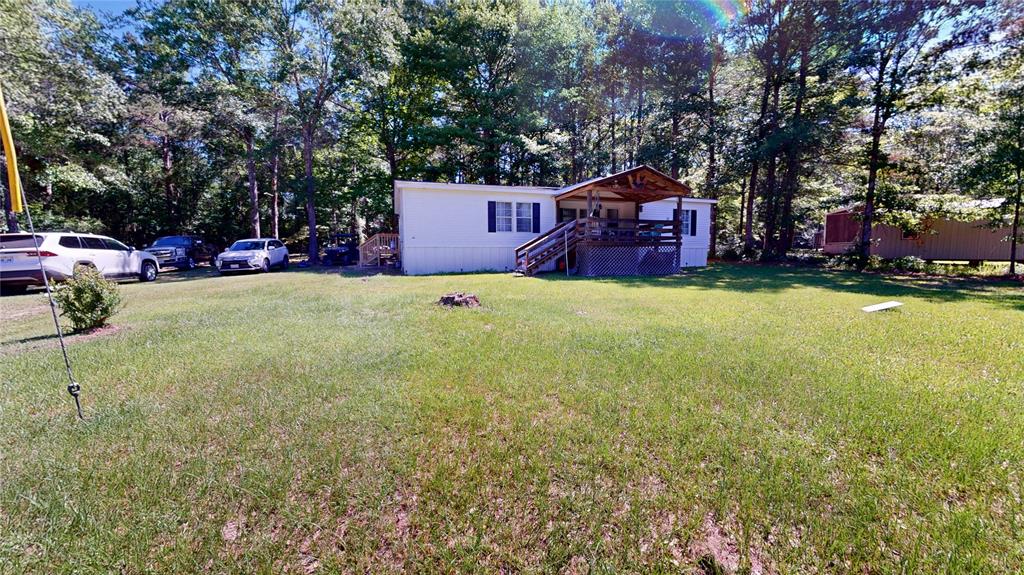 670 Arbin Culpepper Road Jonesboro, LA 71251 - Photo 16 of 17 a backyard of a house with yard and trampoline