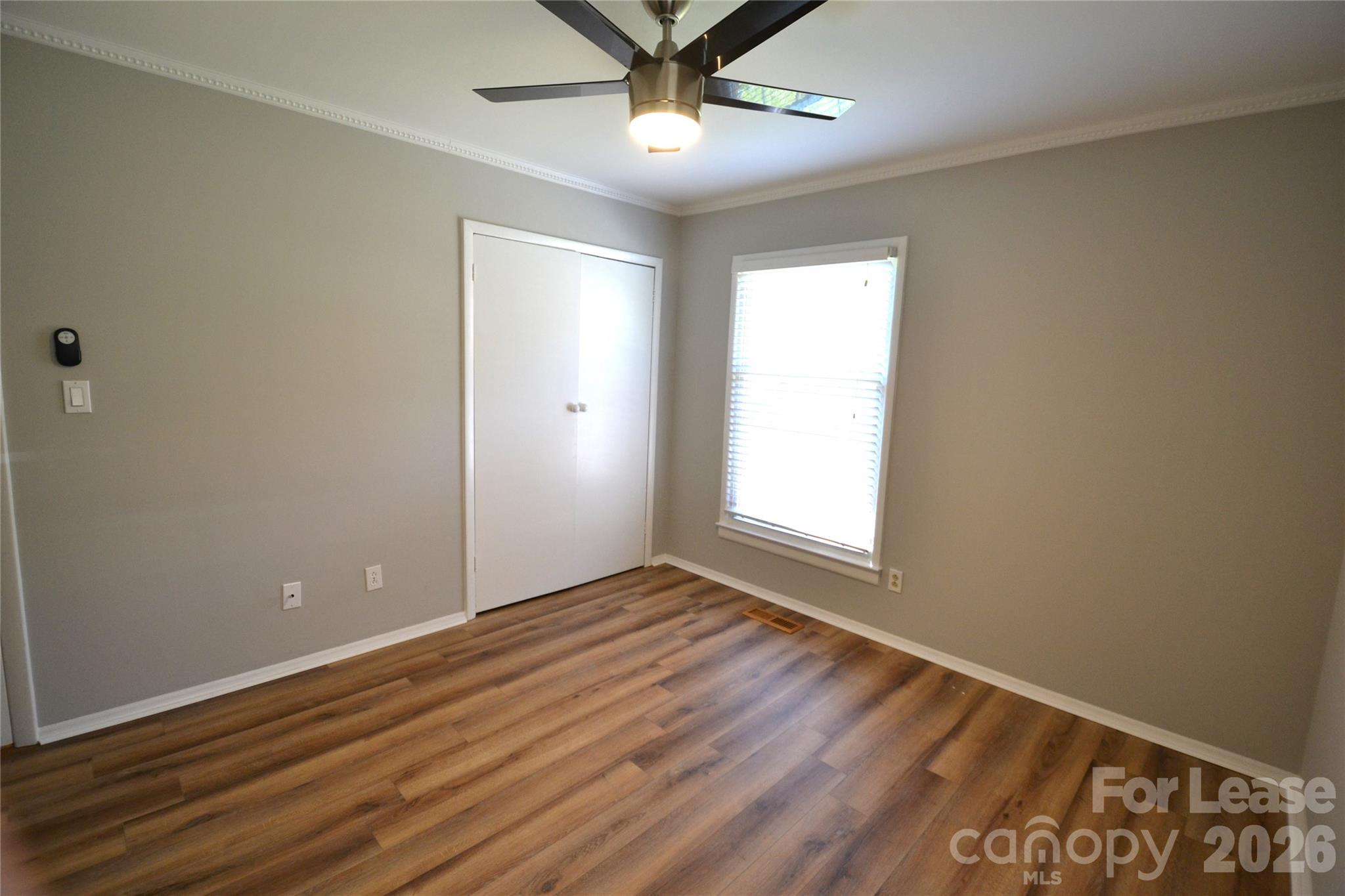 1422 Thermal Road Charlotte, NC 28212 - Photo 34 of 40 wooden floor in an empty room with a window