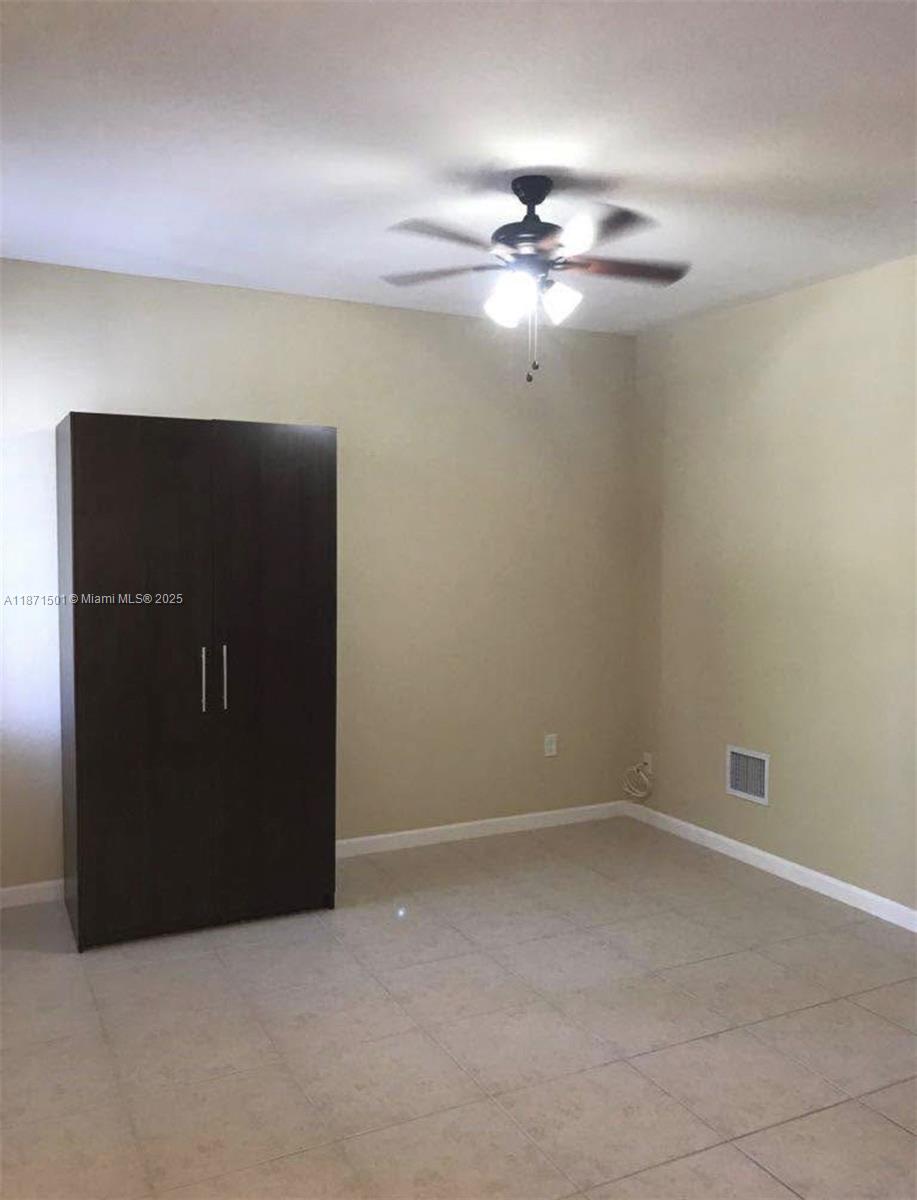 14131 Southwest 276th Street Homestead, FL 33032 - Photo 3 of 6 a view of an empty room