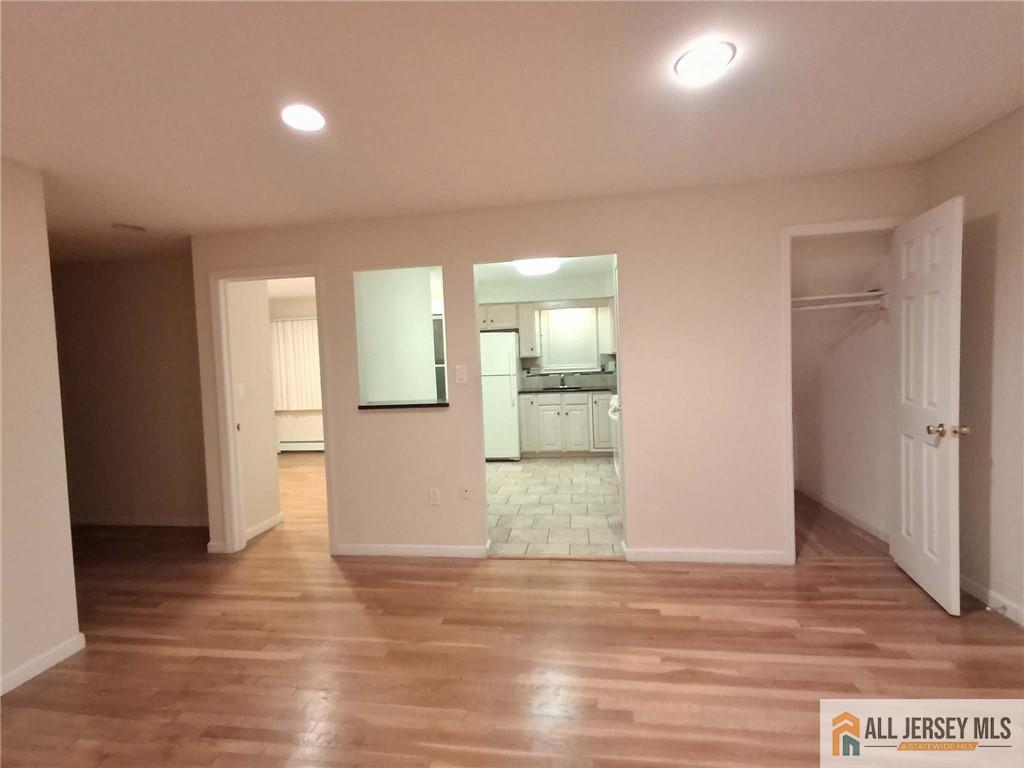 363 Cranbury Road, Unit A3 East Brunswick, NJ 08816 - Photo 13 of 16 a view of empty room with wooden floor