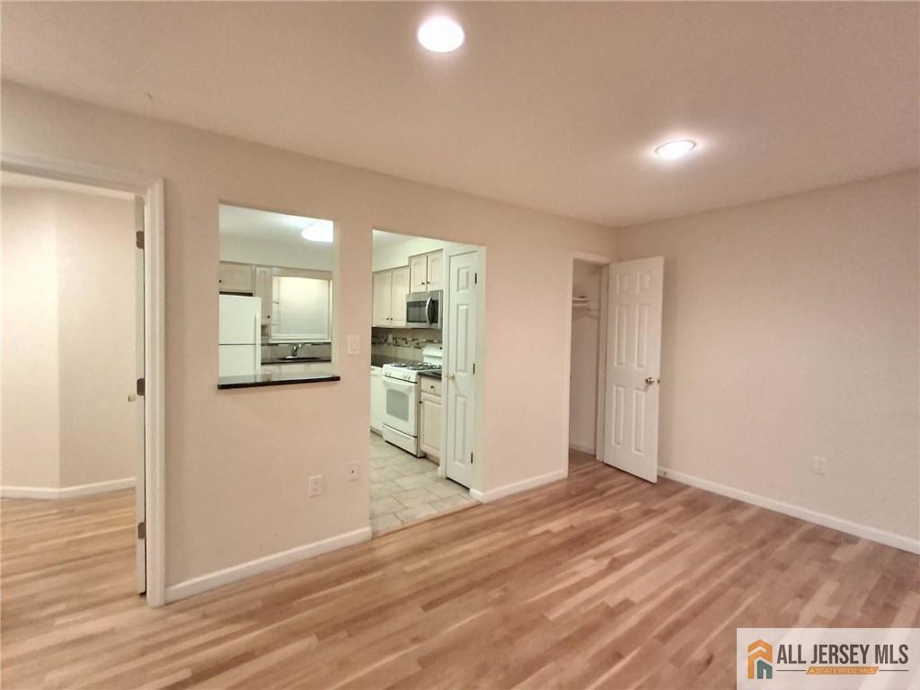 363 Cranbury Road, Unit A3 East Brunswick, NJ 08816 - Photo 6 of 16 a view of kitchen with wooden floor