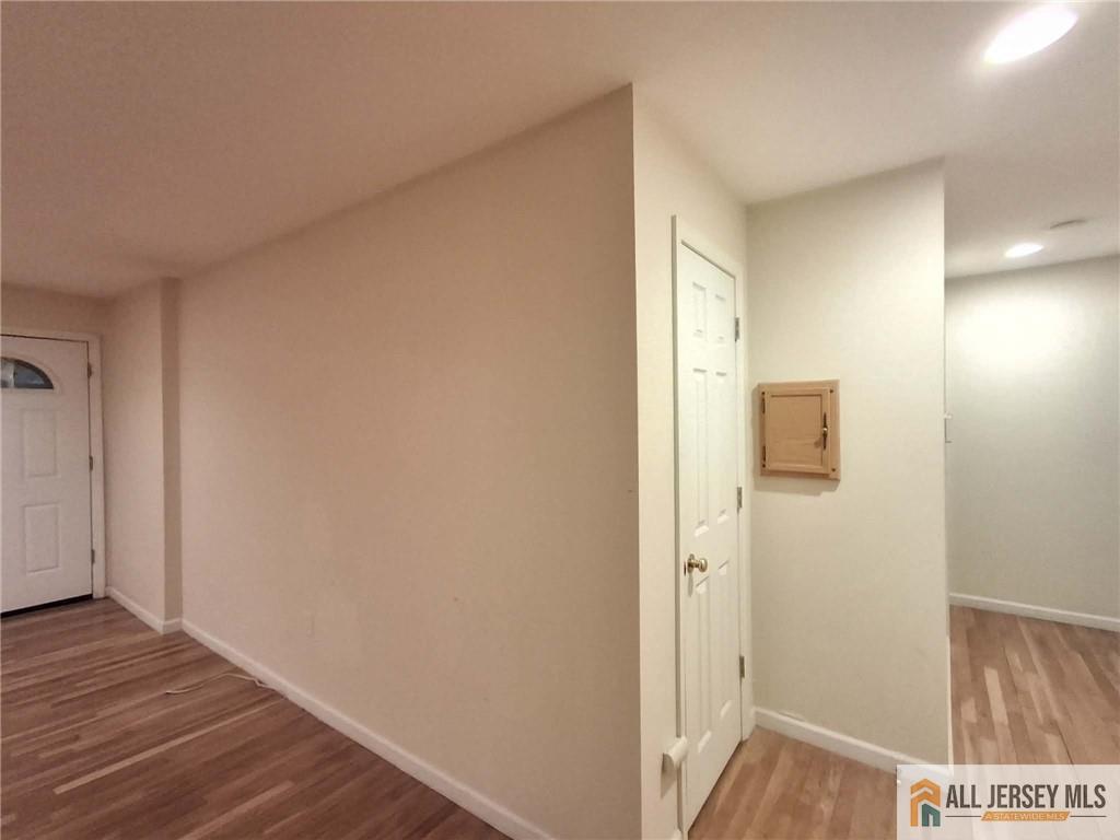 363 Cranbury Road, Unit A3 East Brunswick, NJ 08816 - Photo 8 of 16 a view of a hallway with wooden floor