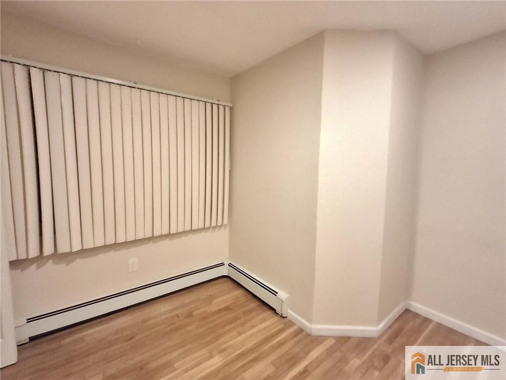 363 Cranbury Road, Unit A3 East Brunswick, NJ 08816 - Photo 10 of 16 a view of a room with wooden floor