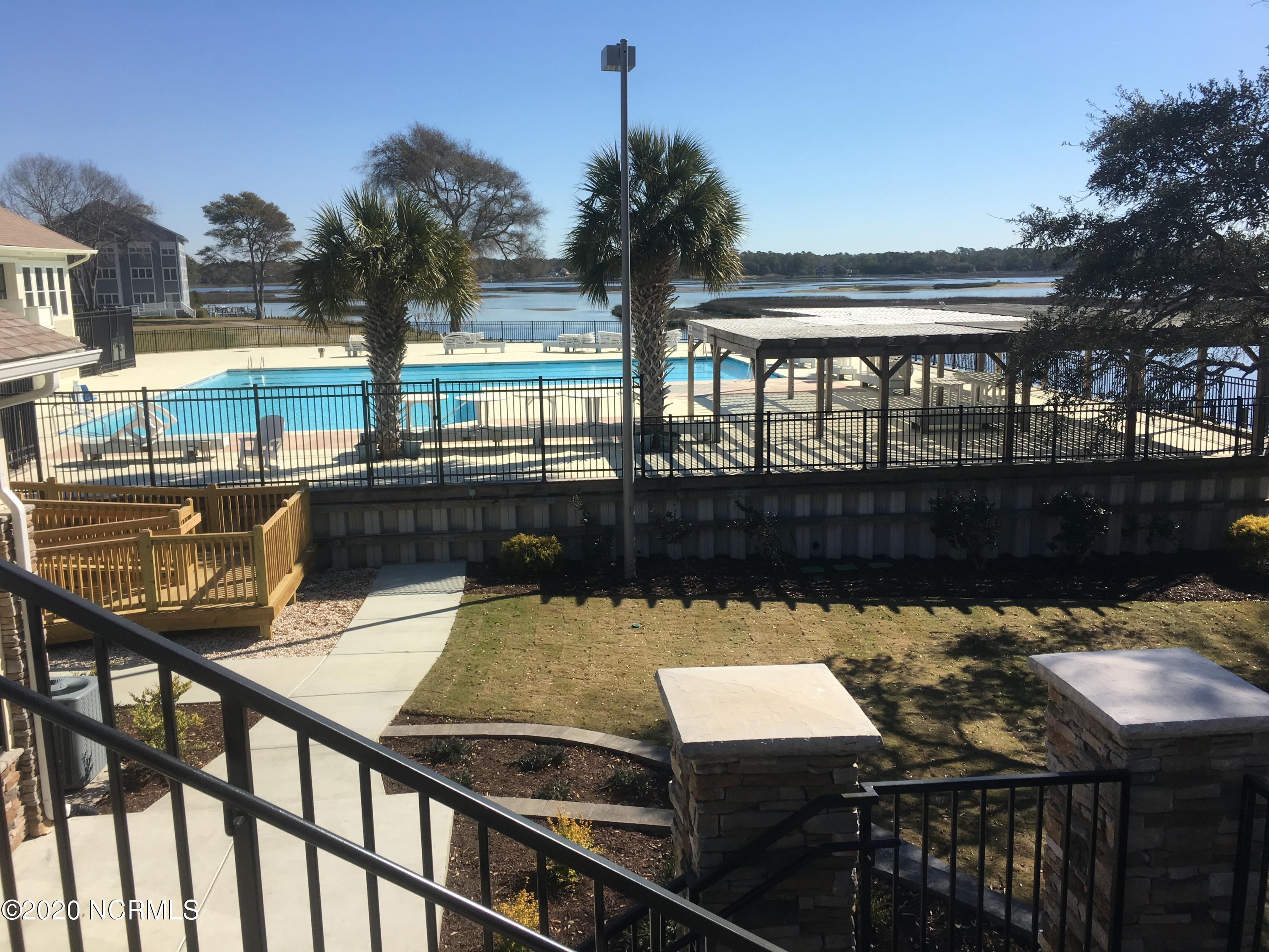 101 Genoe's Point Road Southwest, Unit 1 Supply, NC 28462 - Photo 75 of 82 LWF pool view from clubhouse (1)