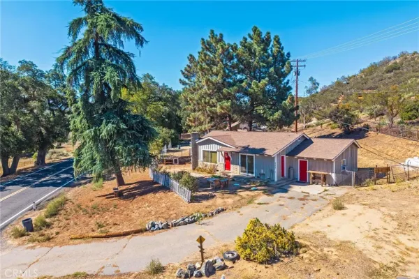 a bedroom with furniture and large windows