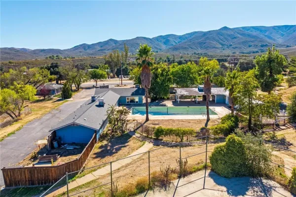 a living room with furniture a fireplace and a table