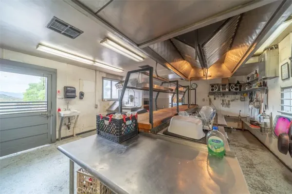 a view of a house with snow on the road