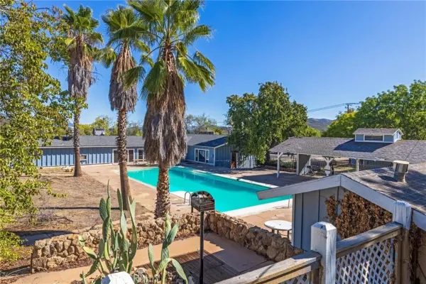 a view of a backyard with large trees