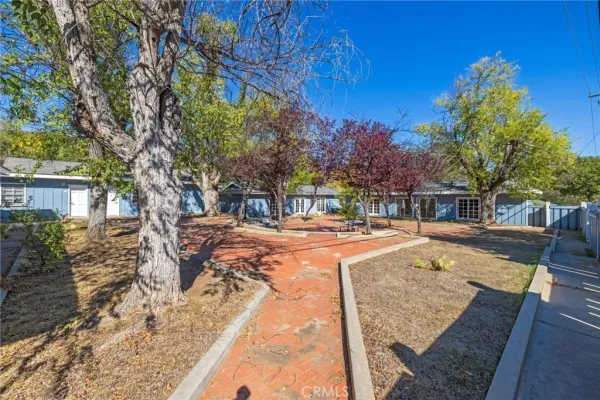 a backyard of a house with a shaded area