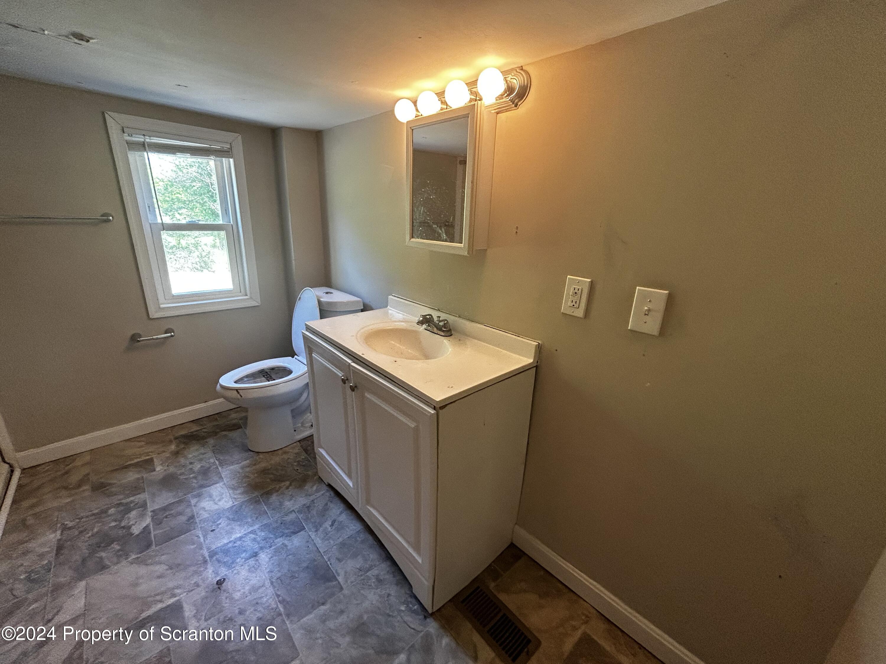 3611 Aberdeen Road Moscow, PA 18444 - Photo 20 of 24 a bathroom with a sink and a toilet