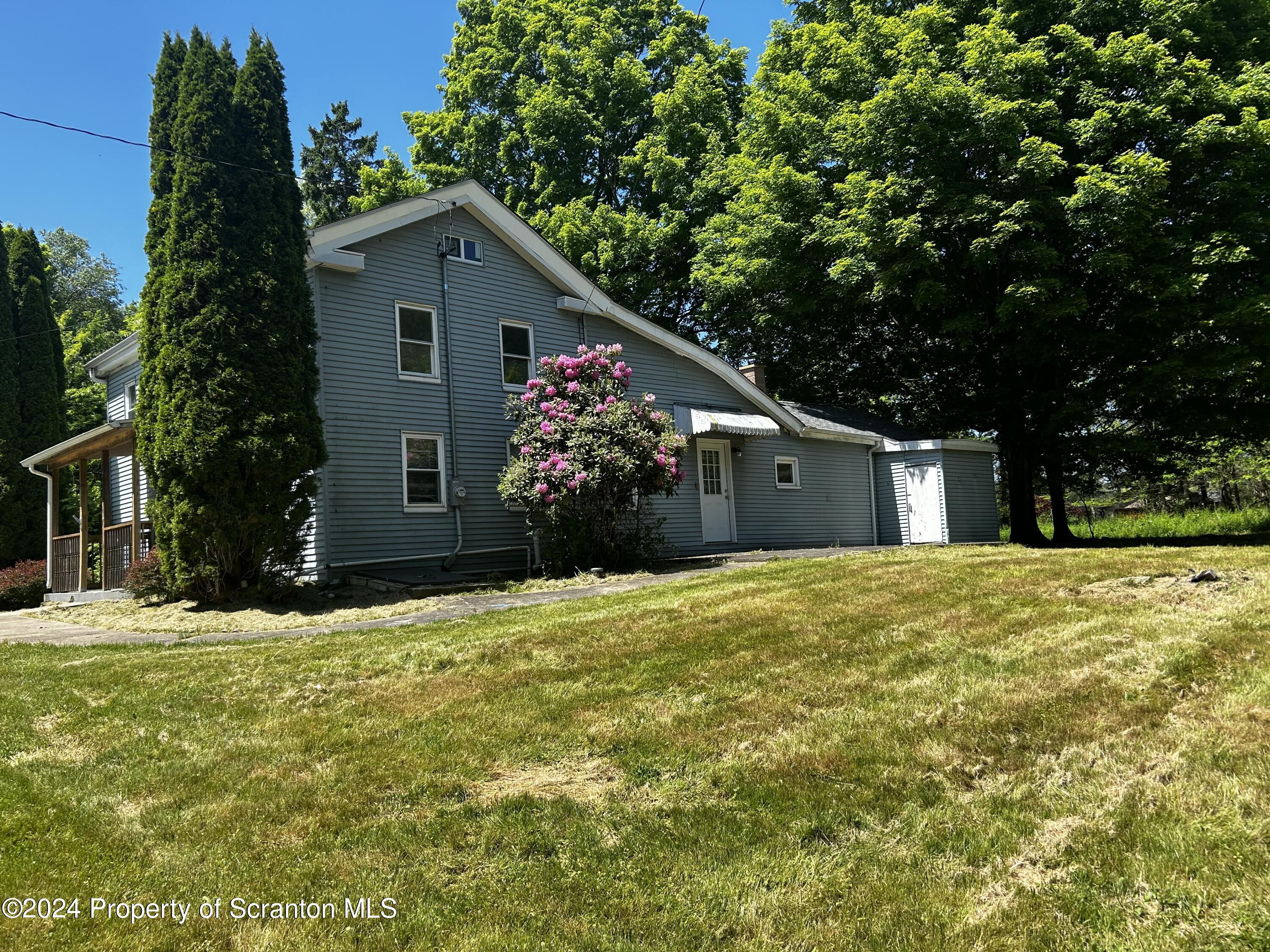 3611 Aberdeen Road Moscow, PA 18444 - Photo 4 of 24 a front view of a house with a yard