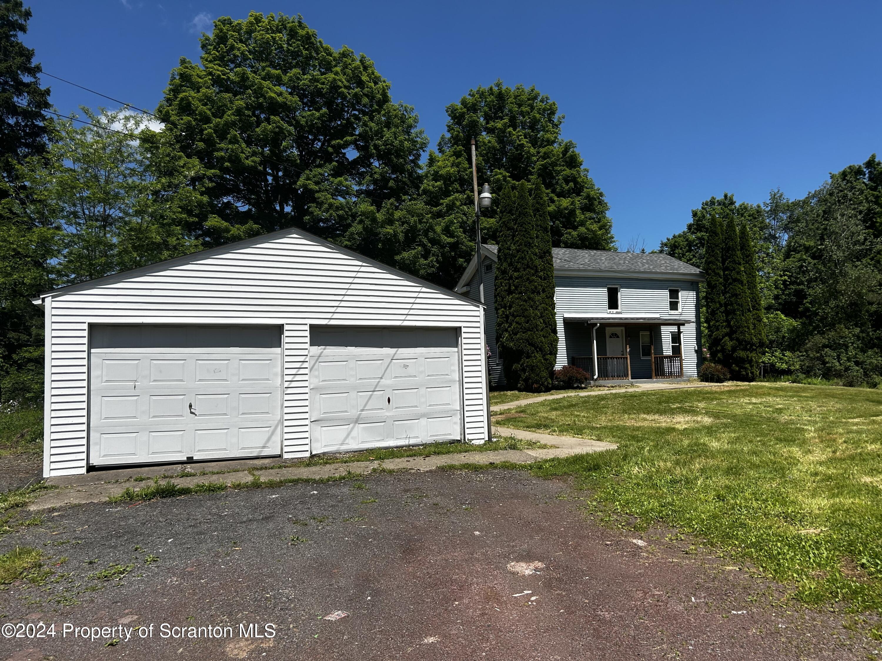 3611 Aberdeen Road Moscow, PA 18444 - Photo 5 of 24 a front view of a house with a yard