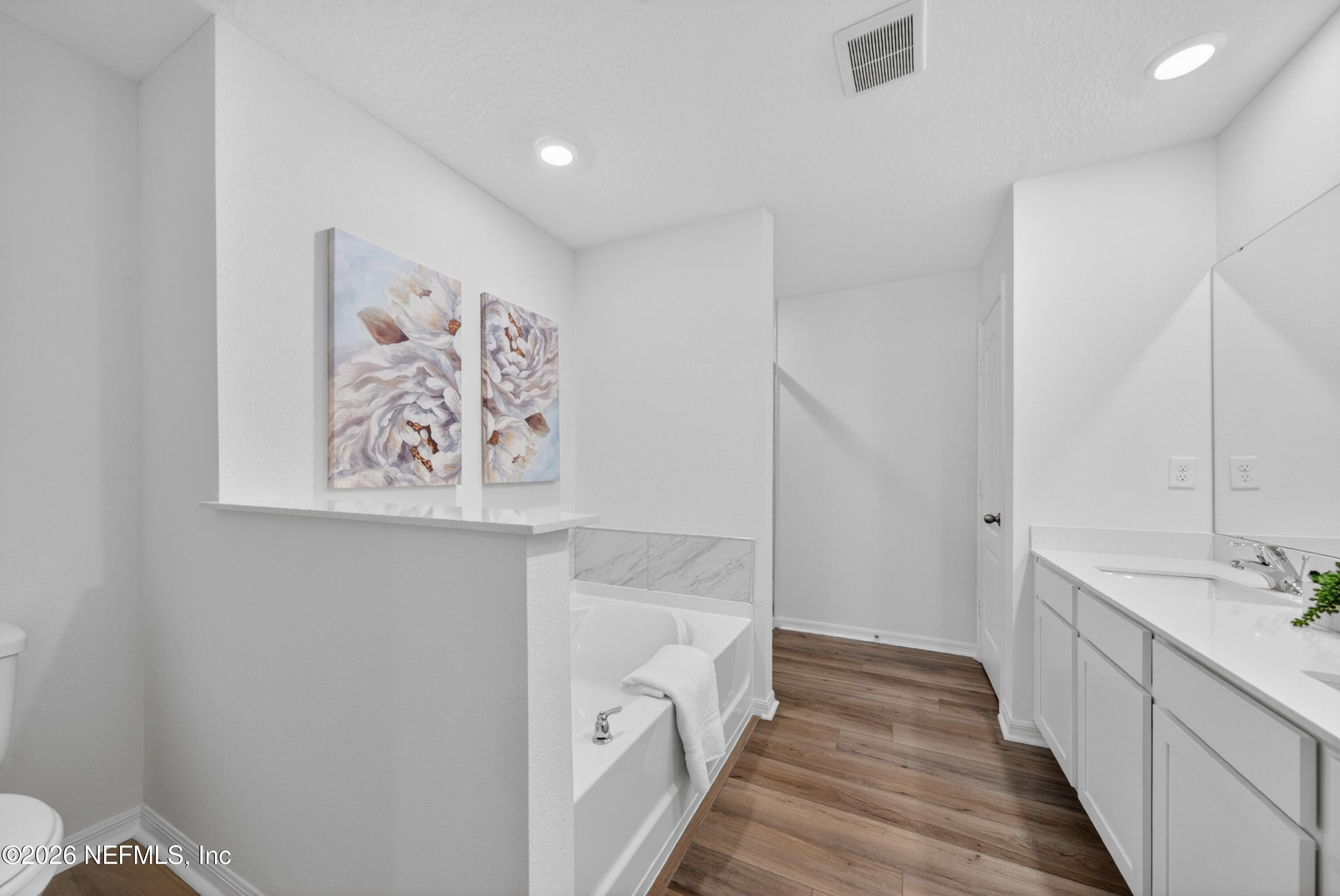 6855 Myrtle Oak Road Jacksonville, FL 32219 - Photo 17 of 27 a bathroom with a sink and a large mirror