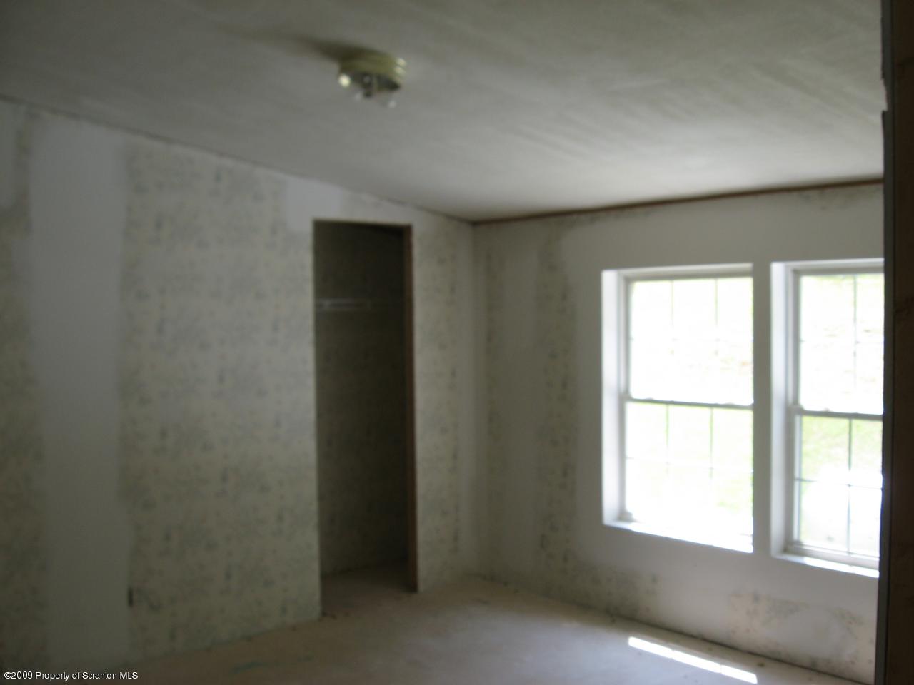 Bass Road Rd Falls Falls, PA 18615 - Photo 3 of 6 an empty room with a window