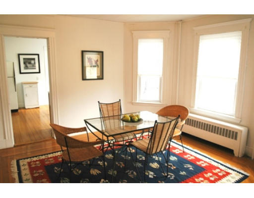 17 Locust Terrace, Unit 2 Cambridge, MA 02138 - Photo 3 of 8 a view of a dining room with furniture and a window