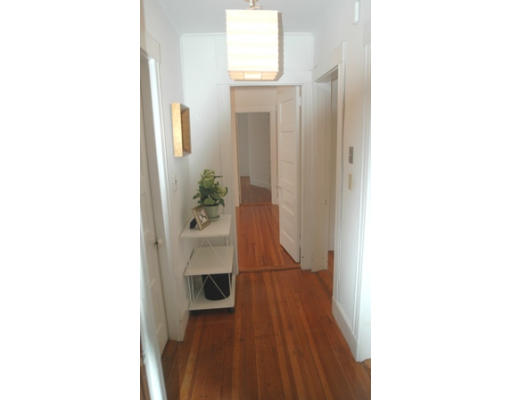 17 Locust Terrace, Unit 2 Cambridge, MA 02138 - Photo 6 of 8 a view of a hallway with wooden floor and a potted plant