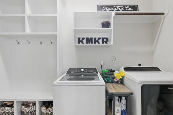 a room with furniture a washer and dryer