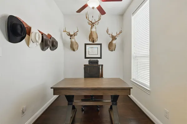 a view of a dining room with furniture and window