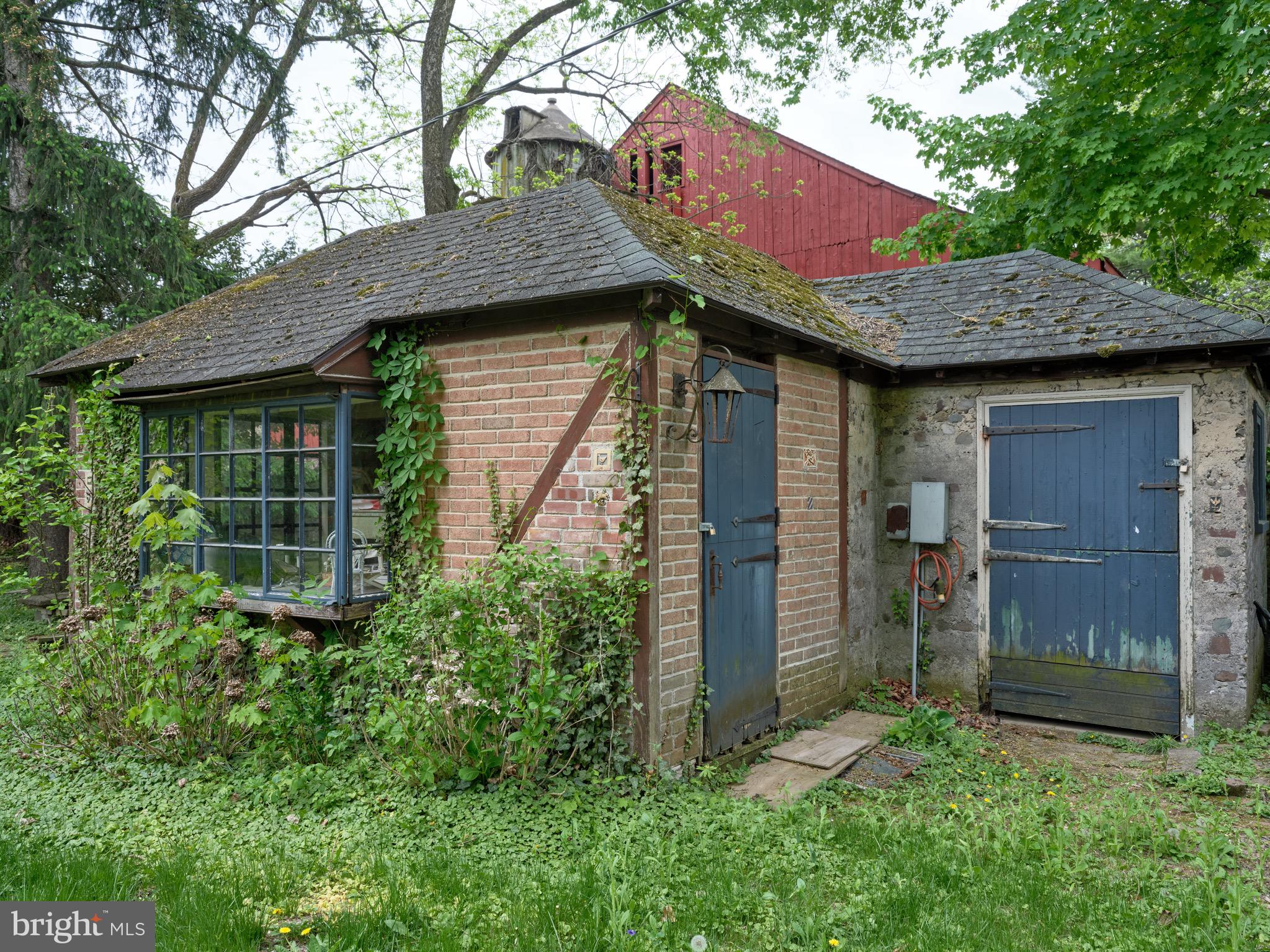2610 River Road New Hope, PA 18938 - Photo 20 of 22 a view of a barn with wooden door and a yard