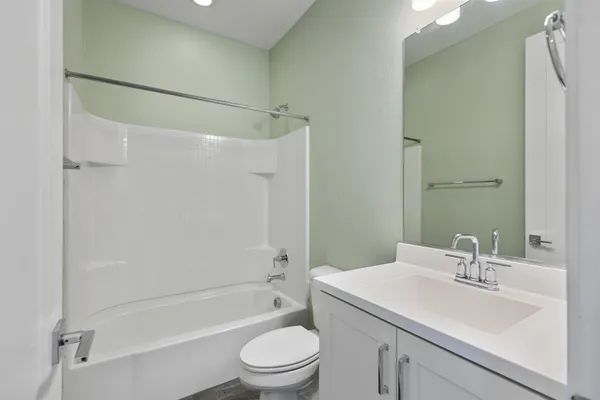 a kitchen with stainless steel appliances granite countertop a refrigerator a sink and a stove