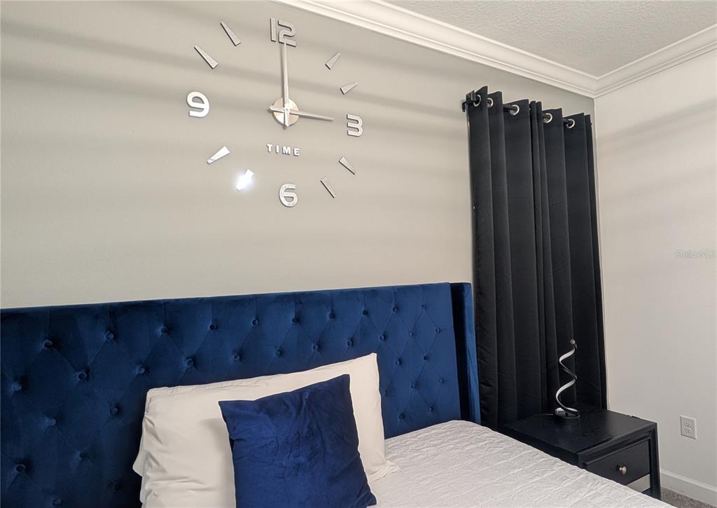 2800 Simile Street Kissimmee, FL 34746 - Photo 19 of 62 a bathroom with a sink a toilet and shower