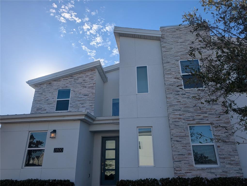 2800 Simile Street Kissimmee, FL 34746 - Photo 2 of 62 front view of a house with a tree
