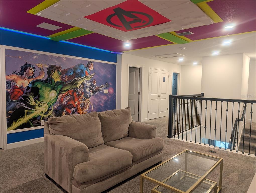 2800 Simile Street Kissimmee, FL 34746 - Photo 28 of 62 a living room with furniture and a potted plant