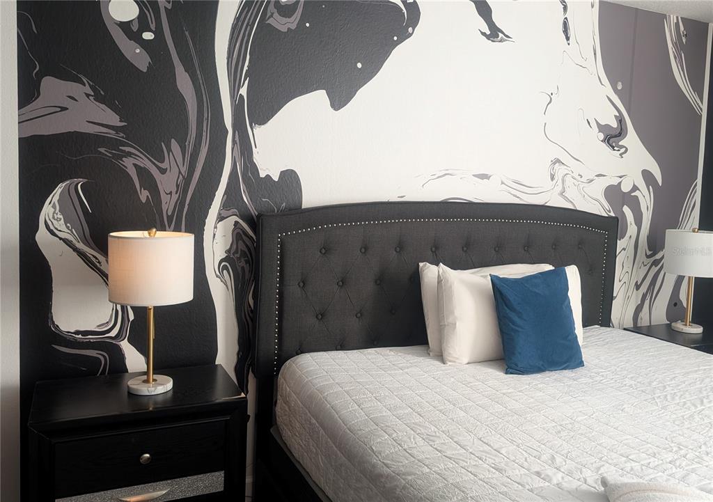 2800 Simile Street Kissimmee, FL 34746 - Photo 33 of 62 a bedroom with a bed and dresser