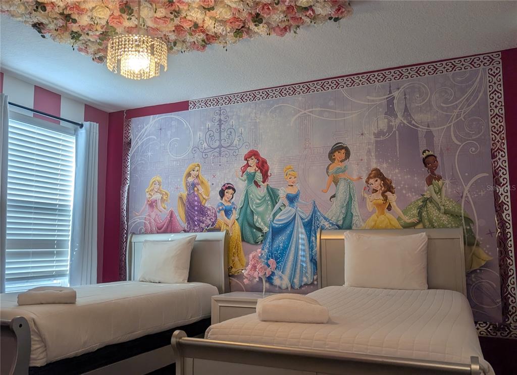 2800 Simile Street Kissimmee, FL 34746 - Photo 34 of 62 a bedroom with a bed and a couch