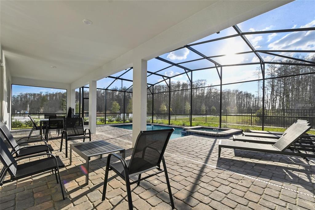 2800 Simile Street Kissimmee, FL 34746 - Photo 43 of 62 a patio with patio table and chairs