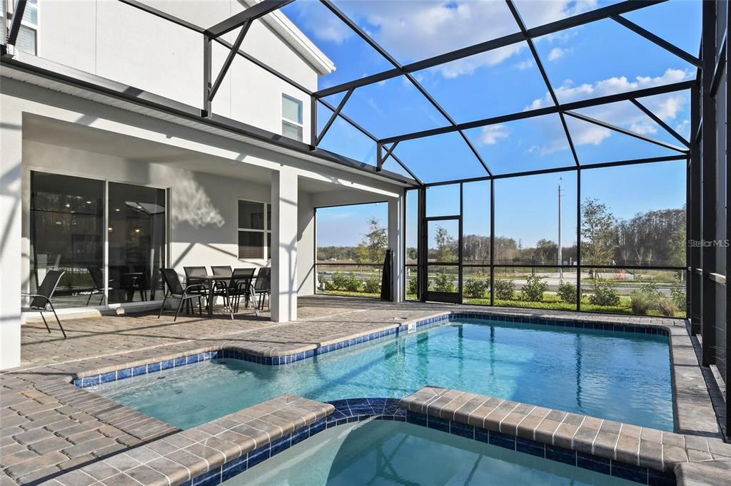 2800 Simile Street Kissimmee, FL 34746 - Photo 44 of 62 a view of a swimming pool with a porch