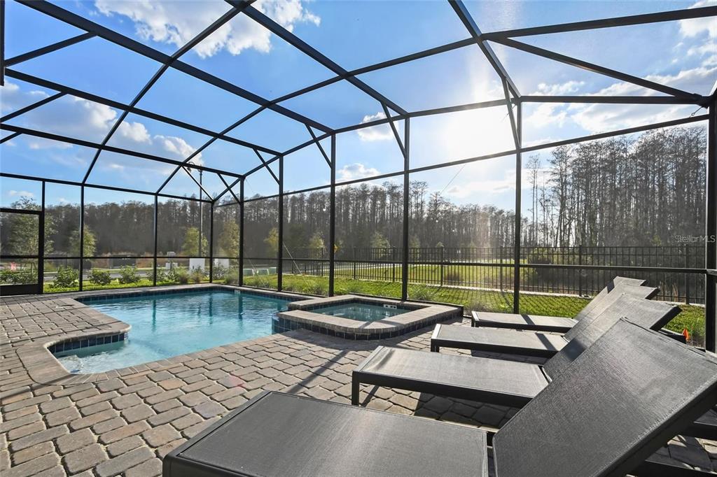 2800 Simile Street Kissimmee, FL 34746 - Photo 45 of 62 a living room with couch and large windows
