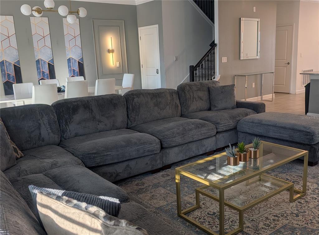 2800 Simile Street Kissimmee, FL 34746 - Photo 7 of 62 a living room with furniture and a fireplace