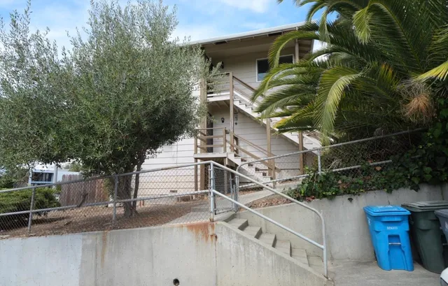 a view of a house with a tree