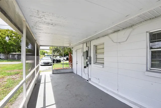 a view of a porch and garden