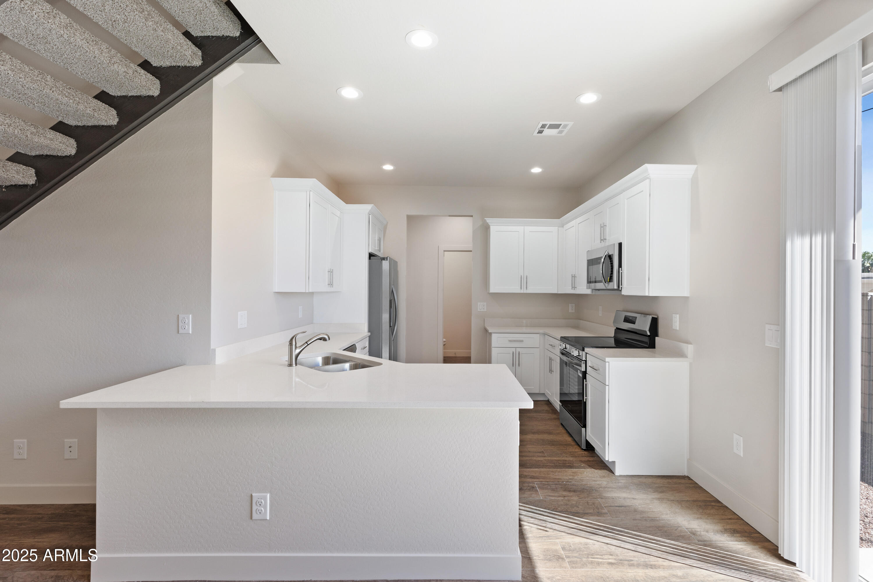4307 North 13th Place Phoenix, AZ 85014 - Photo 12 of 35 a bathroom with a sink a mirror and a shower
