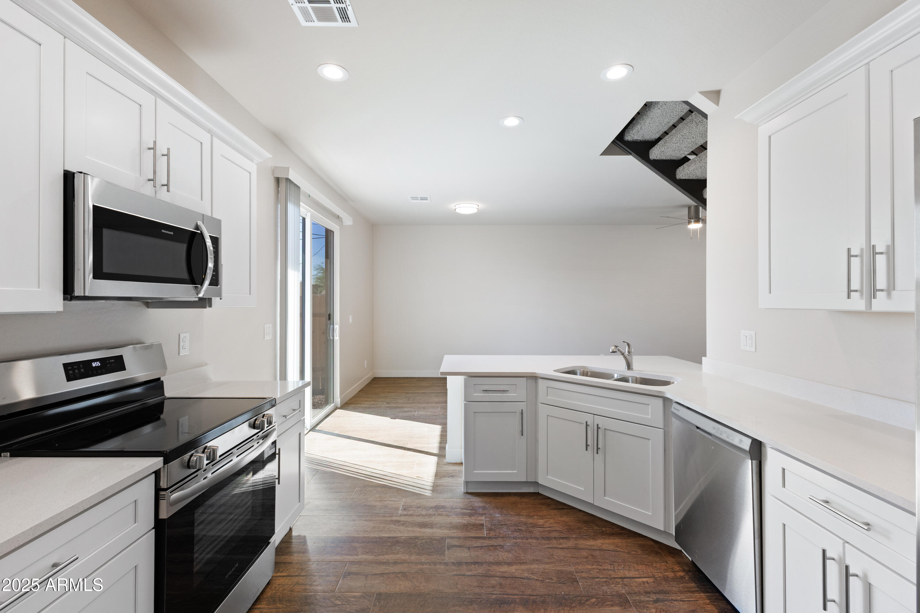 4307 North 13th Place Phoenix, AZ 85014 - Photo 15 of 35 a kitchen with a sink stove and microwave