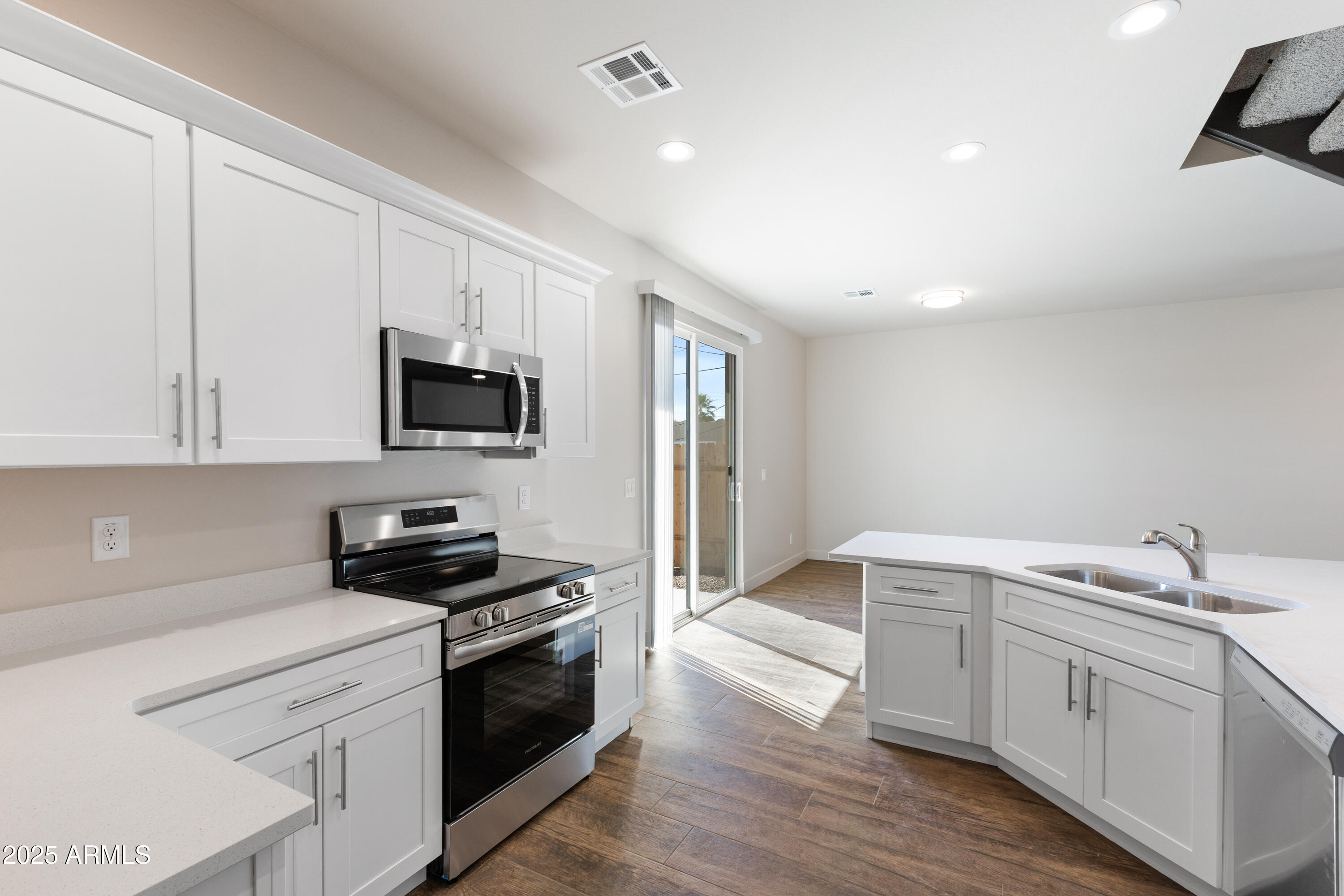 4307 North 13th Place Phoenix, AZ 85014 - Photo 16 of 35 a kitchen with a sink stove and microwave