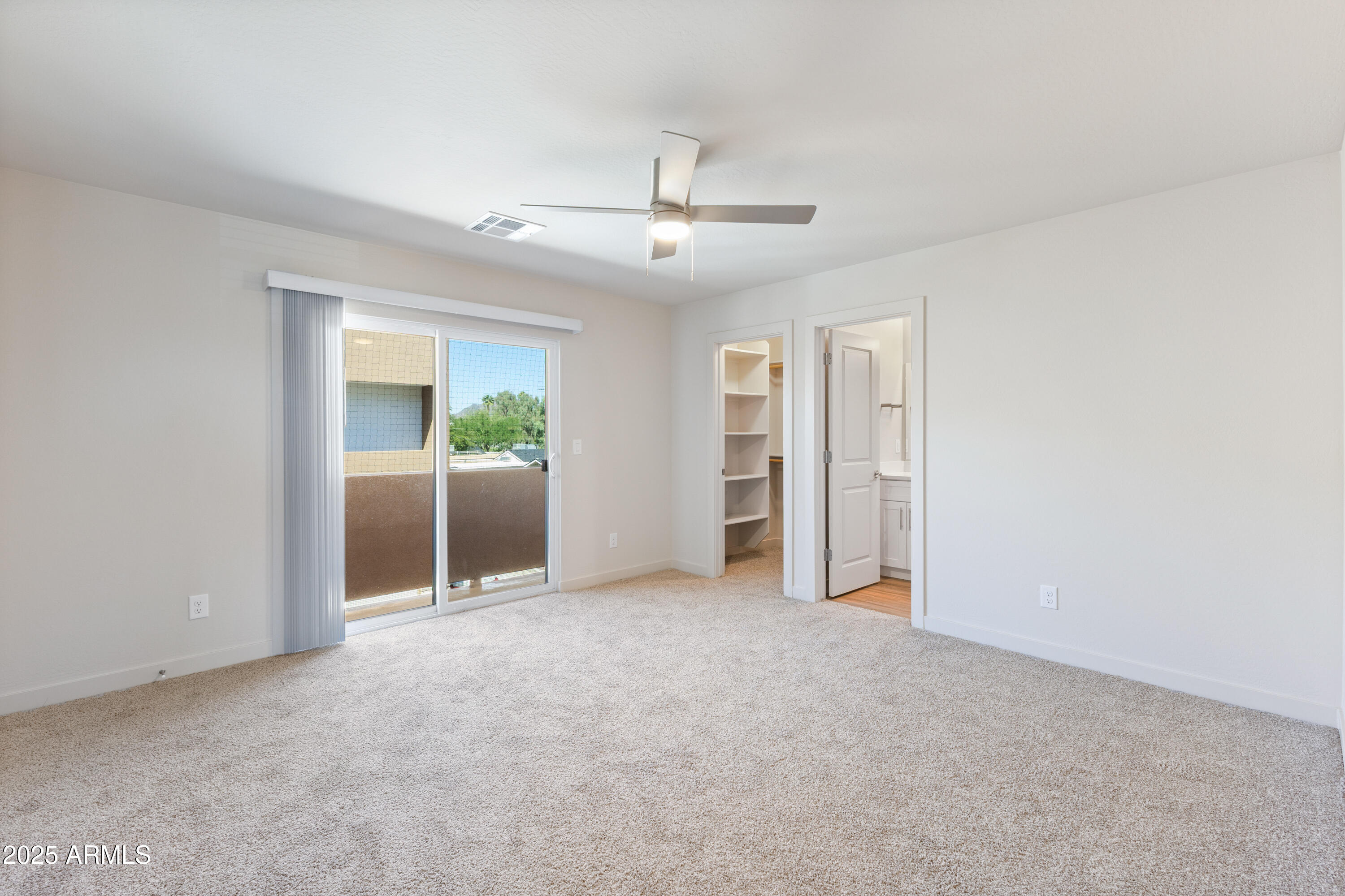 4307 North 13th Place Phoenix, AZ 85014 - Photo 27 of 35 an empty room with closet and windows